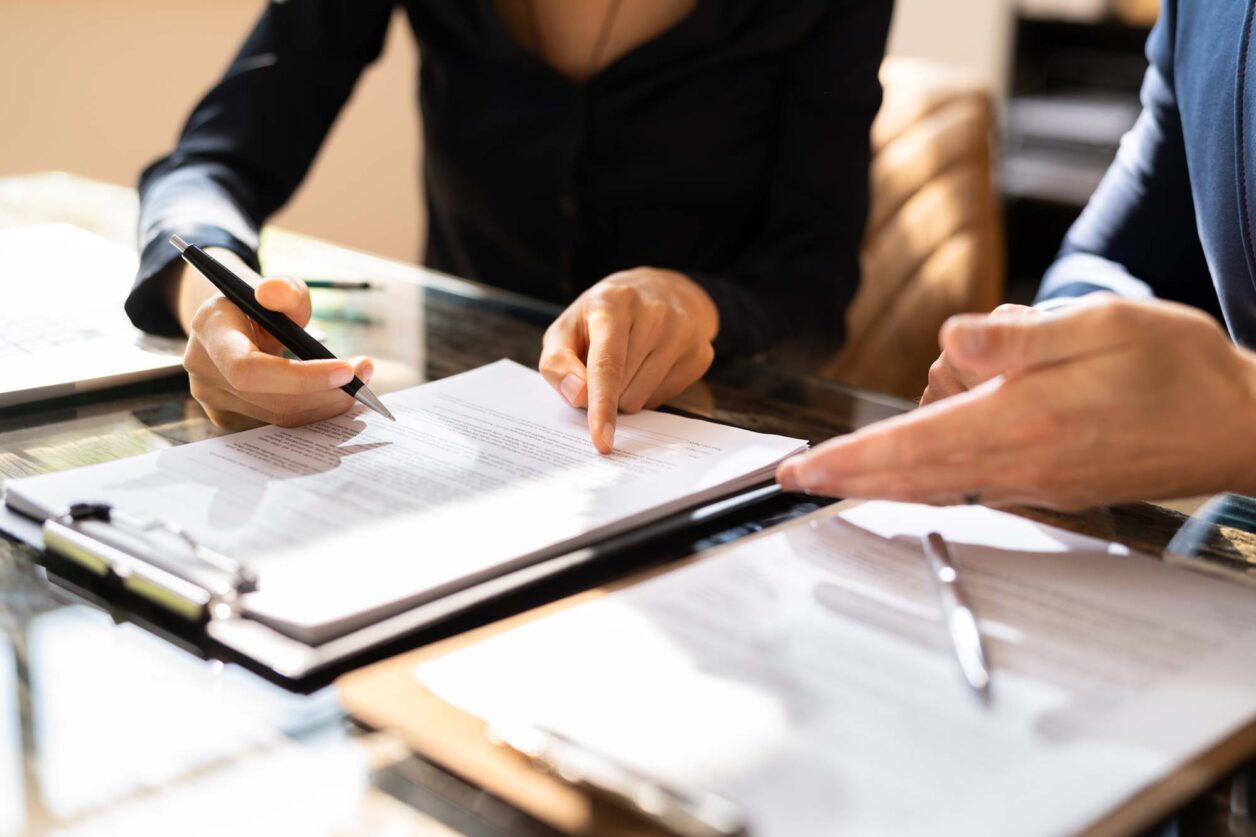 Employees filling out paperwork